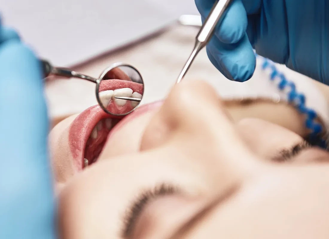 A dentist examining a patient